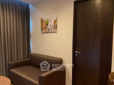 Cozy interior with modern sofa and elegant door, perfect for a stylish living space.