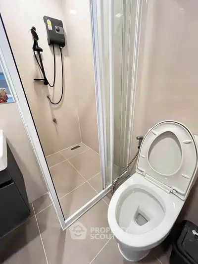 Modern bathroom with shower and toilet in sleek design