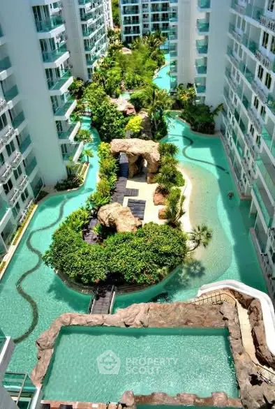 Luxurious condo with stunning pool and lush greenery view