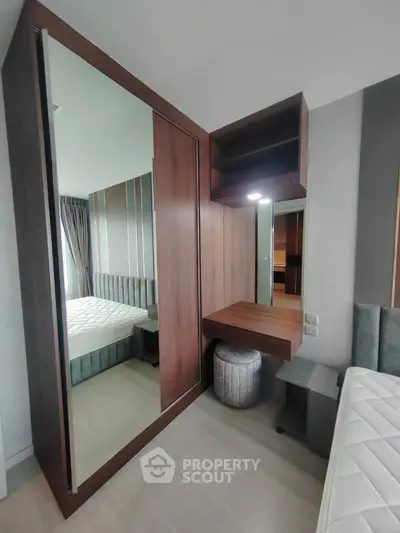 Modern bedroom with sleek wooden wardrobe and stylish decor