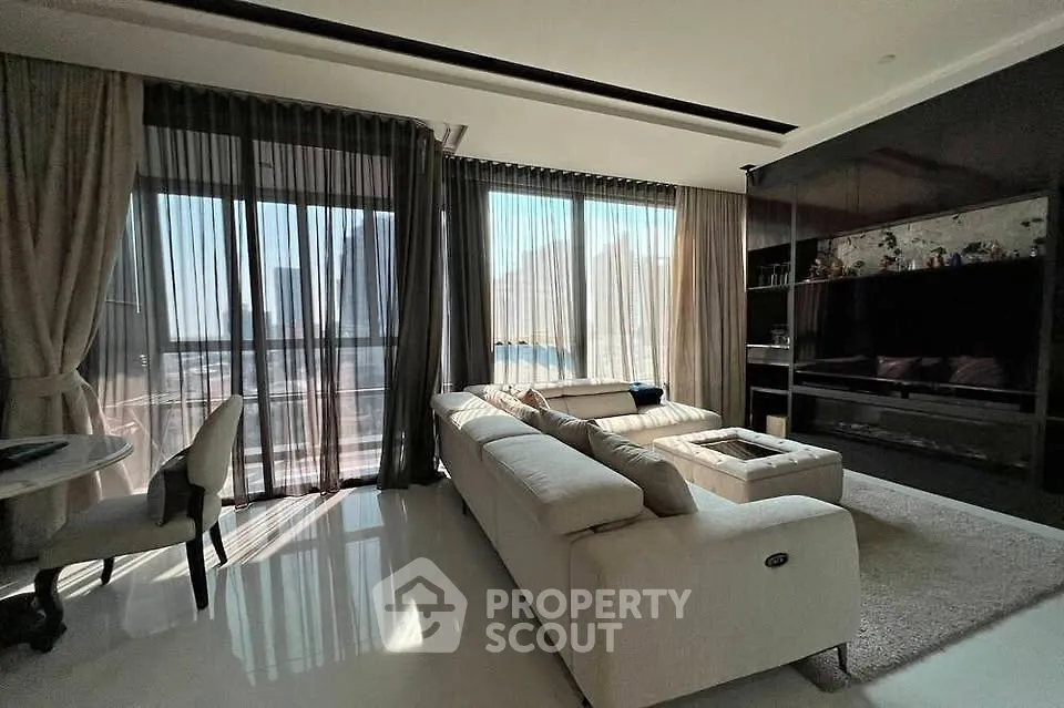 Luxurious living room with modern decor and stunning city view
