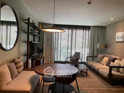 Stylish living room with modern furniture and large window for natural light