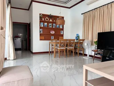 Spacious living room with elegant dining area and modern decor