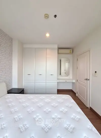Modern bedroom with white wardrobe and minimalist decor