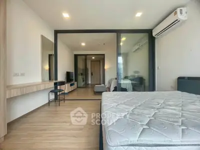 Spacious modern bedroom with sleek design and natural light