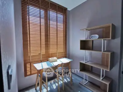Cozy study room with natural light and modern wooden shelves
