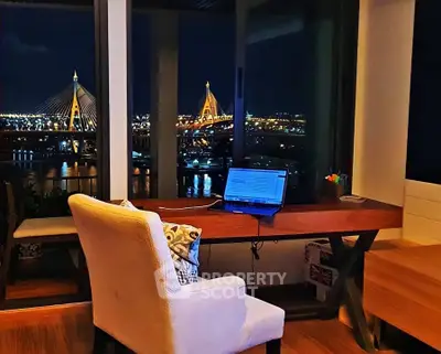 Stunning night view from modern home office with bridge in background