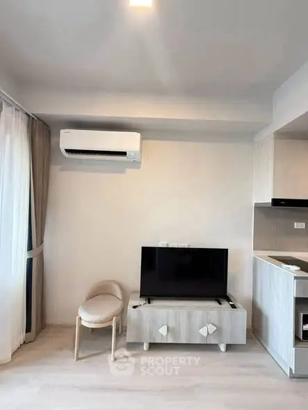 Modern living room with sleek furniture and air conditioning in a stylish apartment.