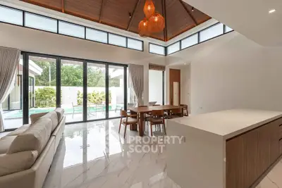 Luxurious open-plan living room with pool view and elegant modern decor