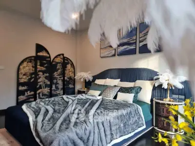 Luxurious bedroom with elegant decor and plush bedding