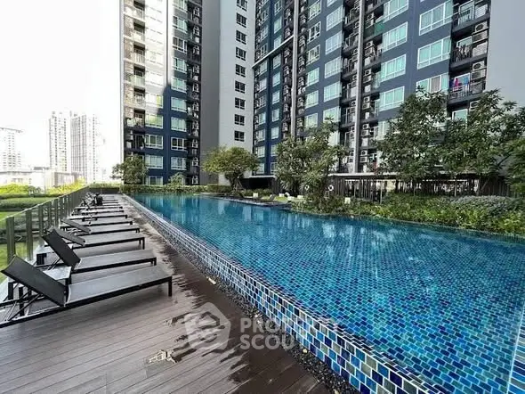 Luxurious high-rise apartment with stunning poolside view and modern amenities.