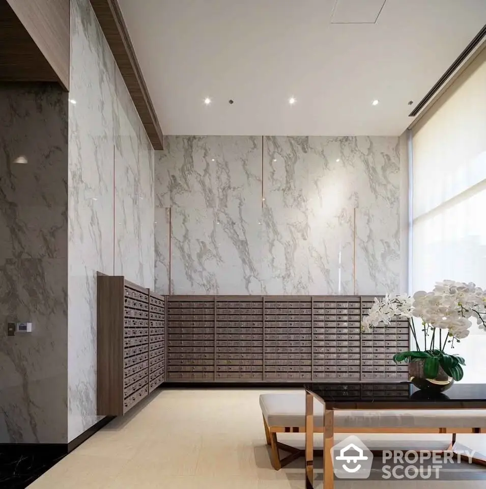 Elegant lobby with marble walls and stylish seating area