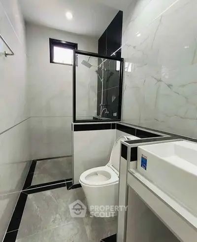 Modern bathroom with sleek design and elegant marble tiles