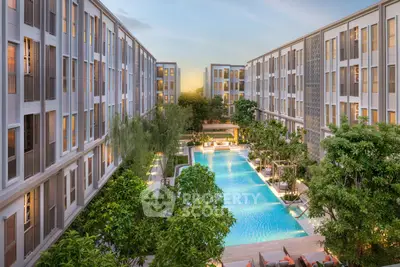 Luxurious apartment complex with stunning central pool and lush greenery