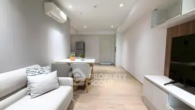 Modern living room with sleek furniture and air conditioning, perfect for comfortable living.