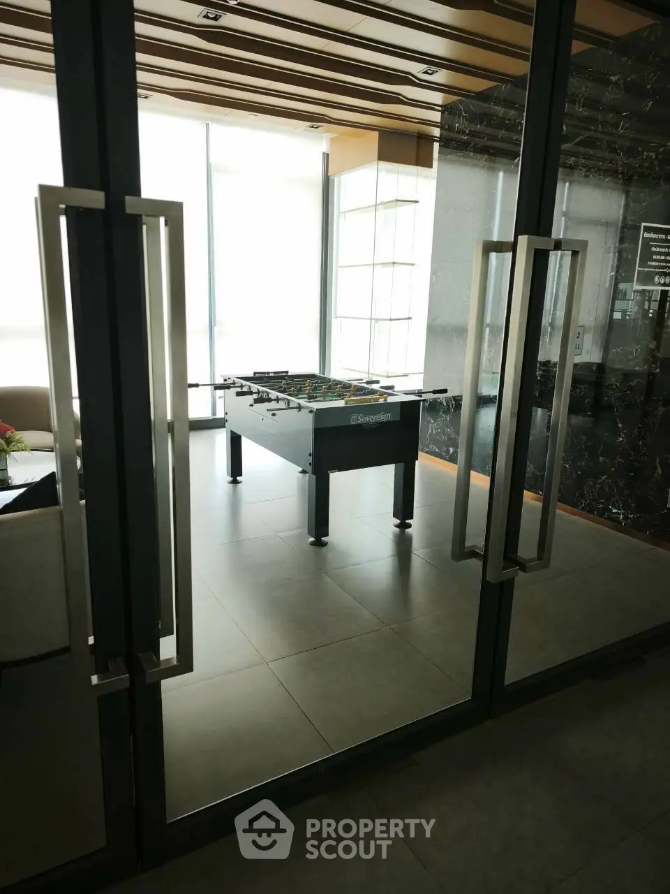 Modern building common area with foosball table and stylish decor