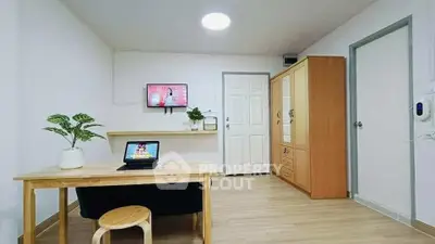 Modern minimalist living room with wooden furniture and smart TV setup.