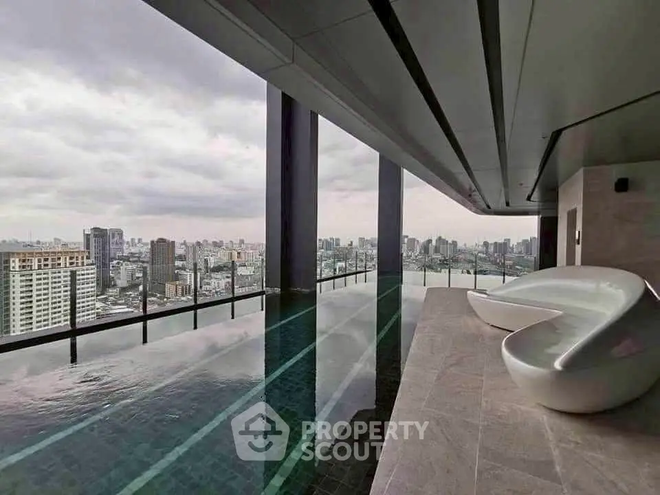 Luxurious rooftop infinity pool with stunning city skyline view, modern design seating area.