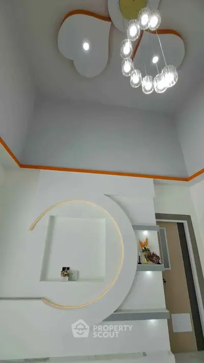 Modern interior with unique ceiling design and stylish lighting fixture