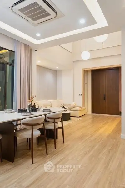 Luxurious modern living room with elegant dining area and stylish decor