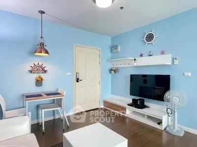 Charming nautical-themed living room with modern decor and entertainment setup.