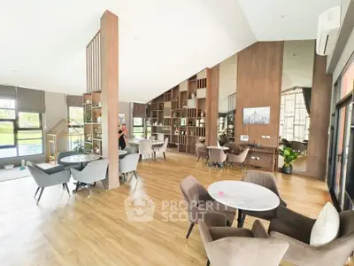 Spacious modern living area with elegant decor and ample natural light