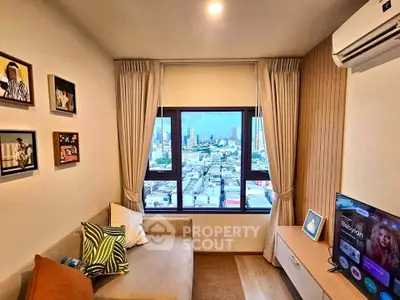 Stylish living room with city view, cozy sofa, and modern decor in urban apartment.