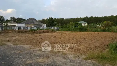 Spacious plot of land with lush greenery, ideal for building a dream home in a serene neighborhood.