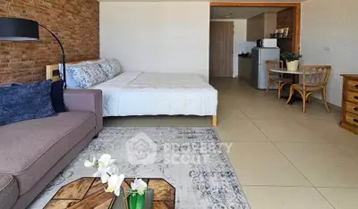 Modern studio apartment with cozy living area and stylish decor