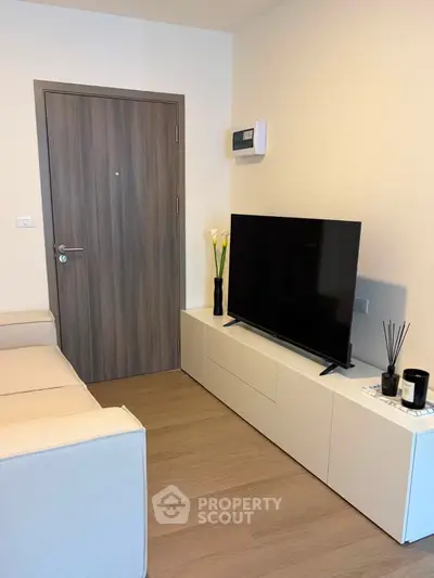 Modern living room with sleek TV setup and minimalist decor