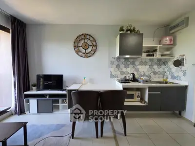 Modern kitchen with open layout and stylish decor in a cozy apartment setting.
