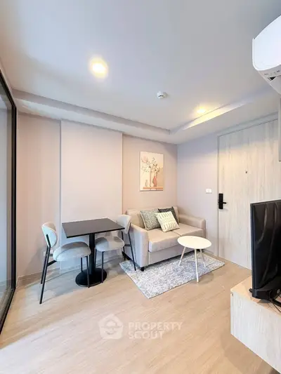 Modern living room with cozy sofa, stylish decor, and dining area in a bright apartment.