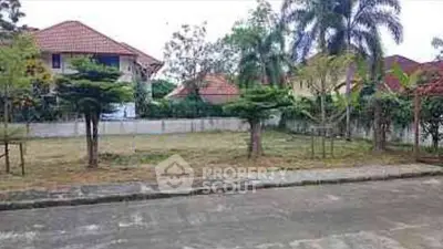 Spacious residential plot with lush greenery and potential for development.