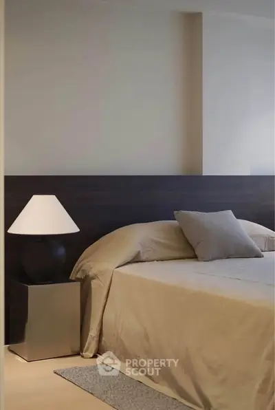 Elegant bedroom with modern decor and cozy lighting, perfect for relaxation and comfort.