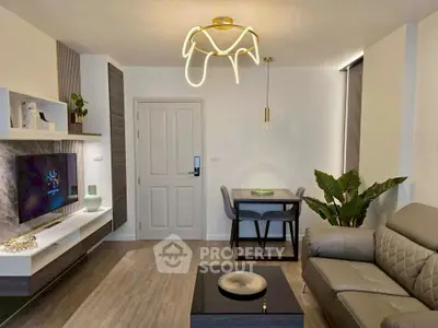 Modern living room with stylish lighting, cozy seating, and elegant decor, perfect for relaxation and entertainment.