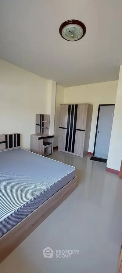 Spacious bedroom with modern furniture and sleek design