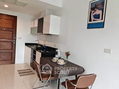 Modern kitchen with dining area in stylish apartment
