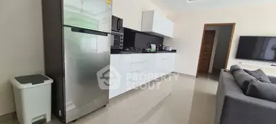 Modern kitchen with sleek appliances and open layout in a stylish home.