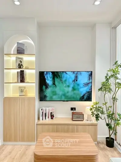 Modern living room with stylish wooden furniture and built-in shelving