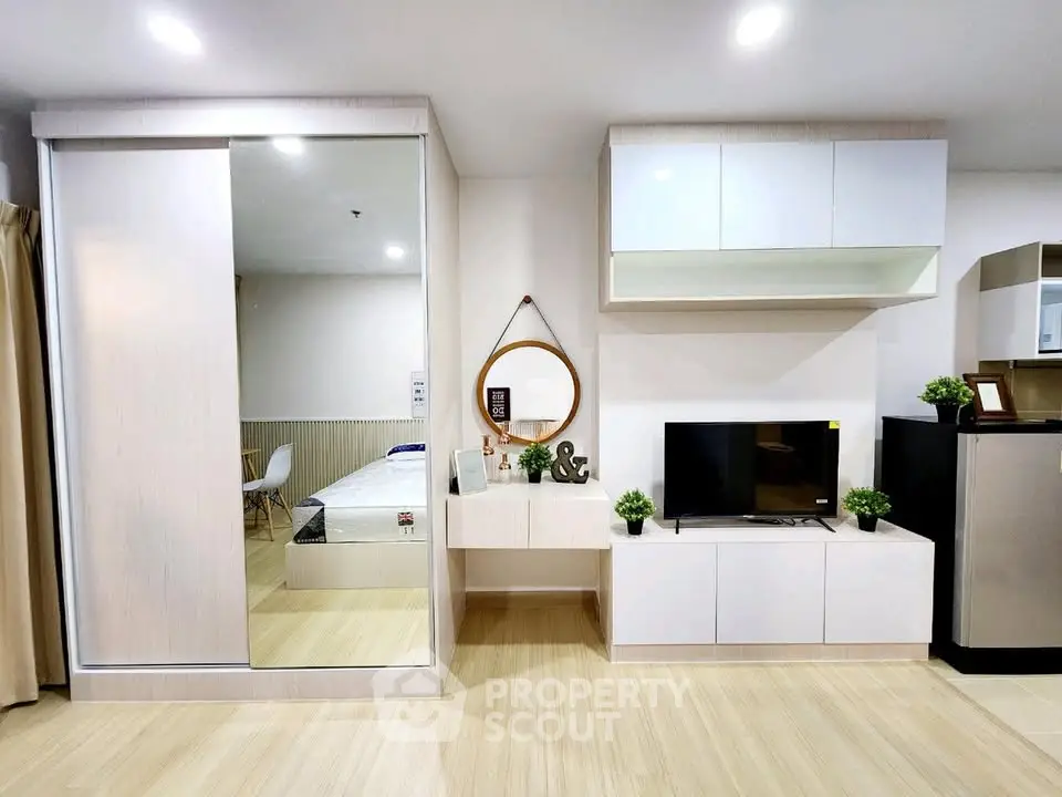 Modern living room with sleek furniture and stylish decor in a contemporary apartment.