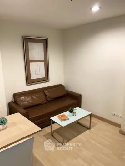 Cozy living room with brown leather sofa and modern decor