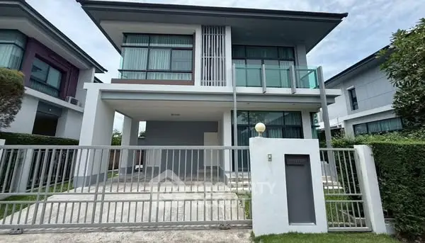 Modern two-story house with sleek design and spacious driveway