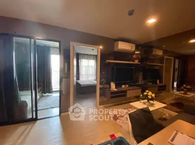 Modern living room with open layout and stylish decor in a contemporary apartment.