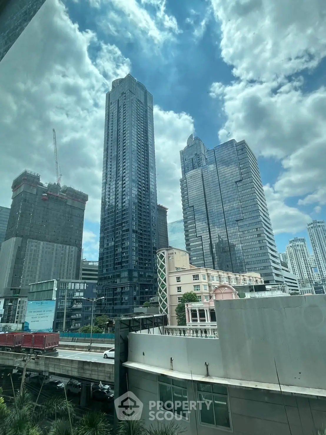 Stunning cityscape view showcasing modern skyscrapers under a vibrant blue sky.