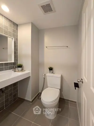 Modern bathroom with sleek fixtures and stylish tile accents