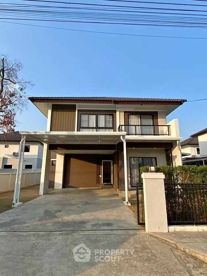 Modern two-story house with spacious driveway and contemporary design in a suburban neighborhood.
