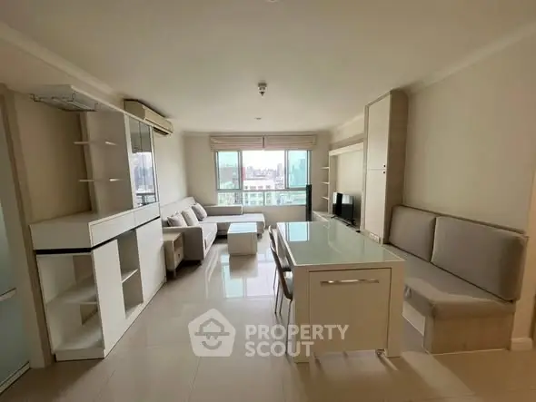 Spacious modern living room with dining area and city view, perfect for urban living.