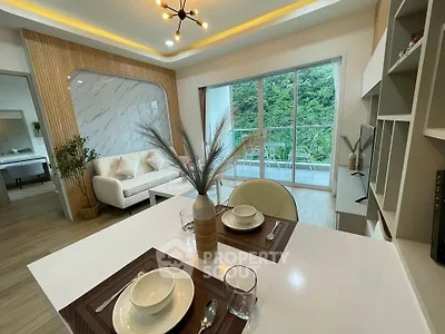 Modern living room with elegant decor and balcony view