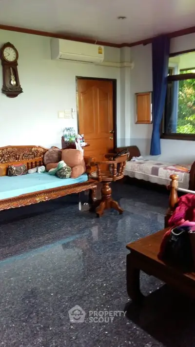 Charming living room with classic wooden furniture and glossy flooring