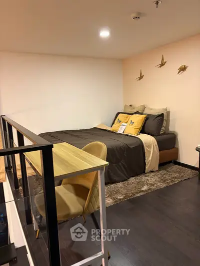 Modern bedroom with stylish decor and cozy ambiance in a contemporary apartment.